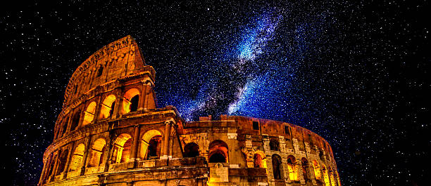 Colosseum at night with stars field, Rome stock photo