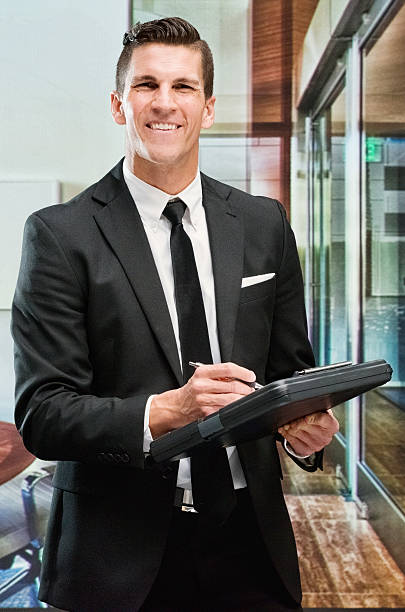 istock Smiling businessman working in office 503079552