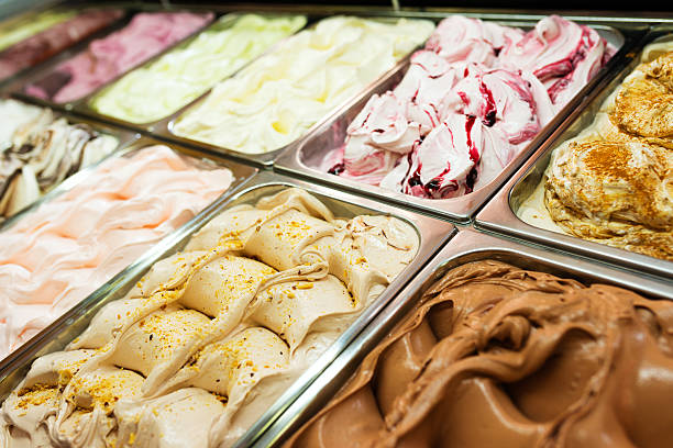 Gelato in a store window Ice cream rack in a snack bar.  gelato stock pictures, royalty-free photos & images