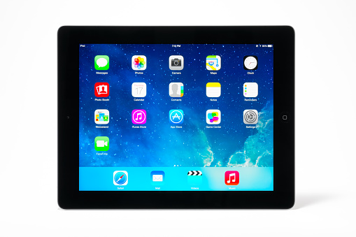 Manila,Philippines - July 17, 2014: Apple Ipad 4th generation (Retina Display) with with iOS 7 home screen. iOS 7 new operation system from Apple Inc. It was announced at the company's Worldwide Developers Conference (WWDC) on June 10, 2013, and was released on September 18, 2013.