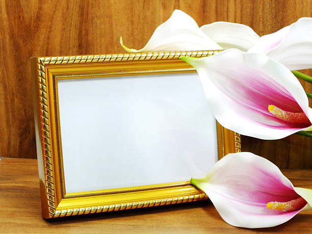 istock blank photo frame and artificial flower 503084804