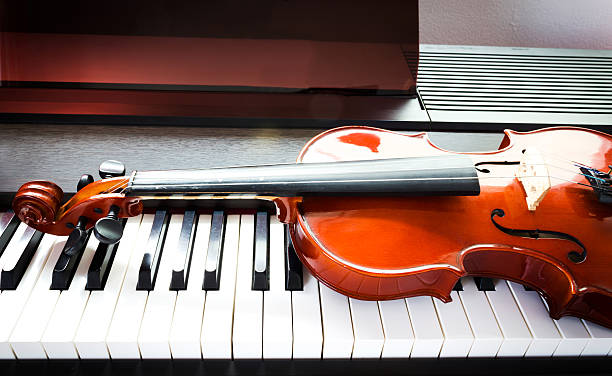 istock Violin and piano keyboard 503085463