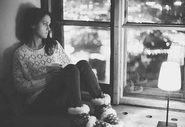 istock Thoughtful girl looking through the window 503085504
