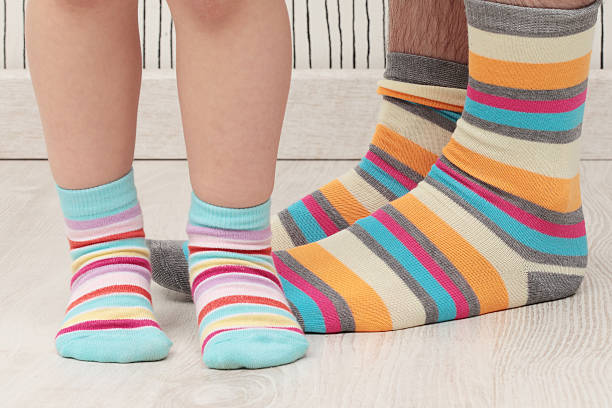 istock father and son in socks 503086275