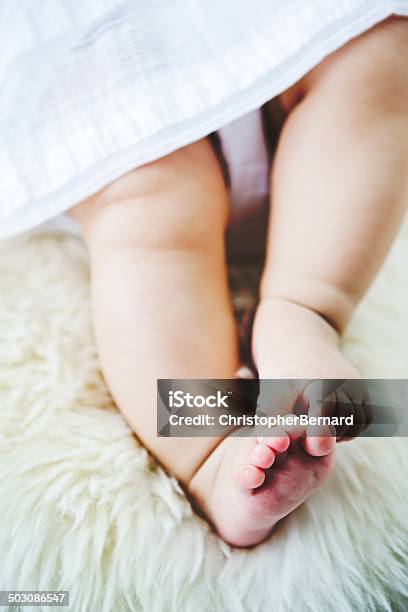 Low Section Of Baby Girl On Rug Stock Photo - Download Image Now - 18-23 Months, Affectionate, Babies Only