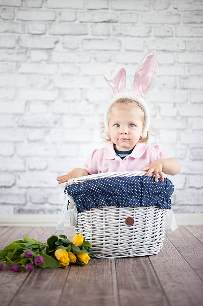 istock Cute baby bunny and tulips 503087087