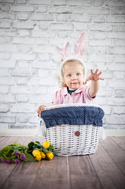 istock Cute baby bunny and tulips 503089195