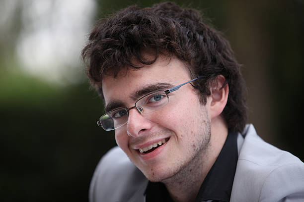 istock Handsome man face with a white perfect smile 503097867