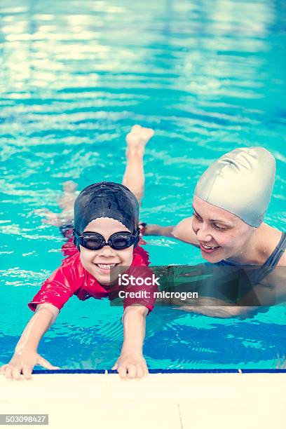 Swimming Class In Indoor Swimming Pool Stock Photo - Download Image Now - Activity, Aquatic Sport, Blue