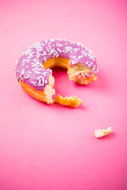 istock Purple Donut On Pink Background 503101389