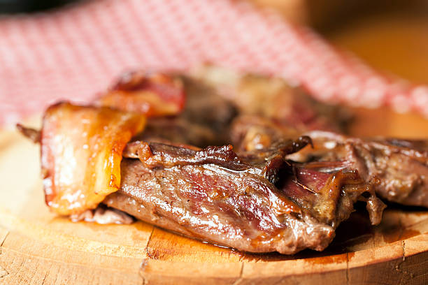 istock Baked wild rabbit meat with bacon 503102489