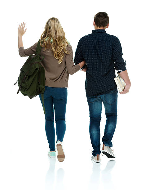 istock Rear view of two students walking 503102587