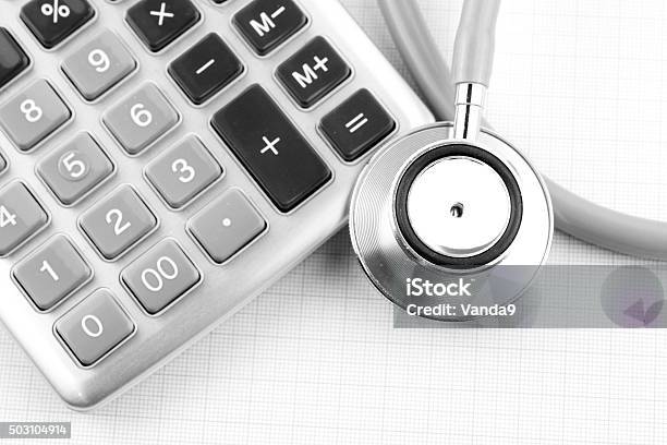 Calculator And Stethoscope Stock Photo - Download Image Now - Calculator, Financial Figures, Gray Color