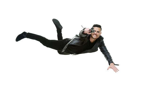 istock Casual man jumping and aiming with gun 503105652