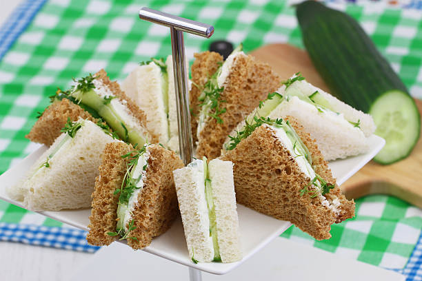 istock White and brown cream cheese and cucumber sandwiches 503106086