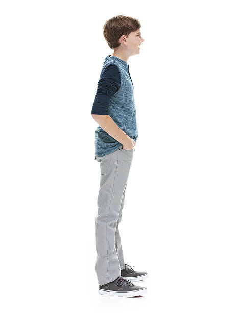 istock Little boy standing and looking away 503106550