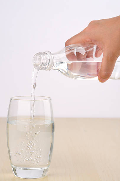 istock Soft Focus of Pouring Water From Bottle into Glass 503108448