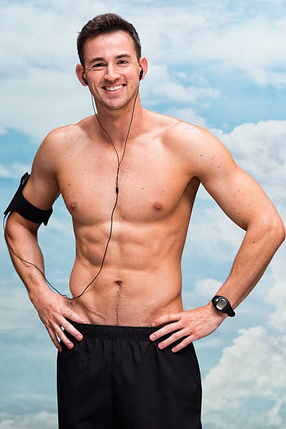 istock Smiling shirtless male runner looking at camera 503109682