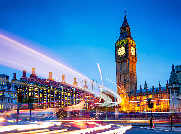 Big Ben, Westminster, London, UK Traffic light trails near Big Ben and the Houses of Parliament in background at dusk, Westminster, London, UK.  big ben stock pictures, royalty-free photos & images
