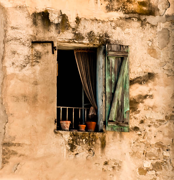 istock French village window, old with blue curtain 503111890