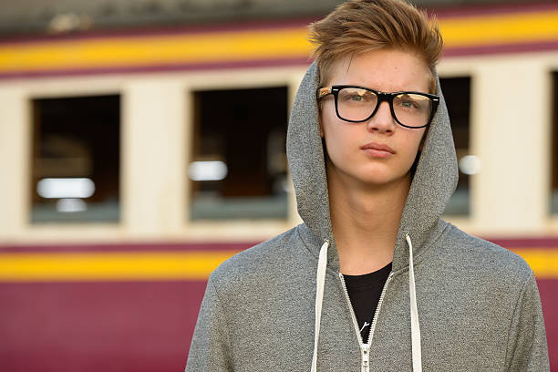 istock Teenager boy outdoors at train station 503112850