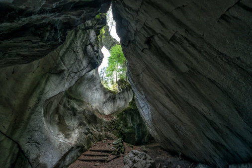 inside a canyon with a natural bridge over the top