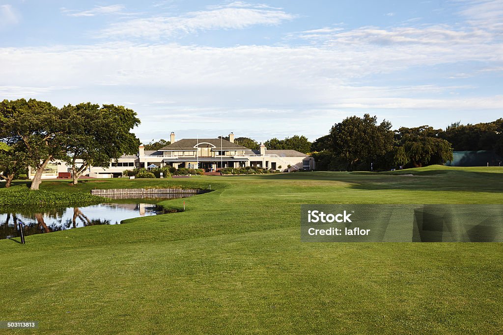 Nestled in scenic splendour Shot of a well maintained golfing estate Agricultural Field Stock Photo