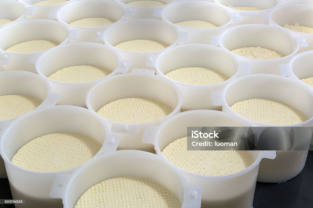 Cheese production in Minas Gerais, Brazil Man prepares the traditional white cheese (Queijo Minas) Manufacturing Stock Photo