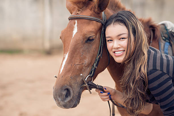 istock Chestnut pony and girl 503114039