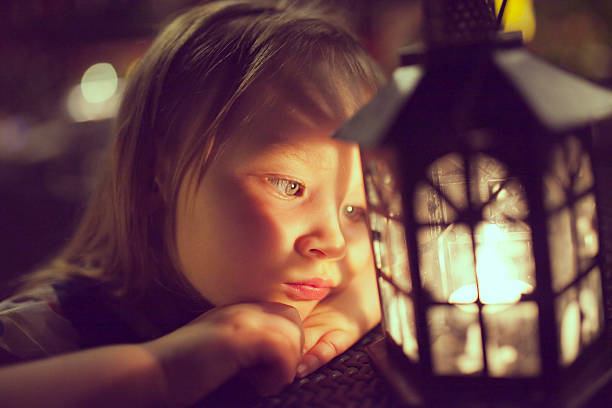 istock little girl looking at the lantern 503115617