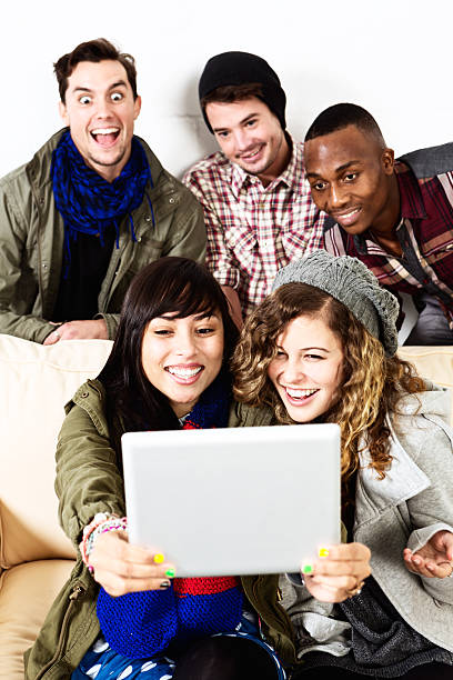 istock Five friends with varied expressions take selfie using digital tablet 503116219