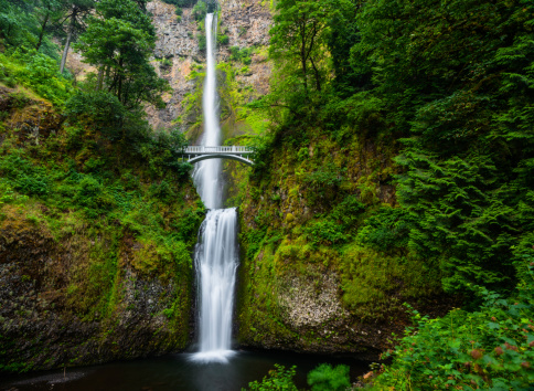 Beautiful Multnomah falls in Columbia River Gorge, Oregon, USA on a fine spring morning