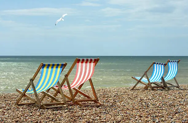 Deck chairs on an English Beach overlooking the english Channel