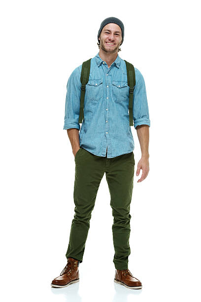 Smiling hipster standing & looking at camera Smiling hipster standing & looking at camerahttp://www.twodozendesign.info/i/1.png rolled up sleeves stock pictures, royalty-free photos & images