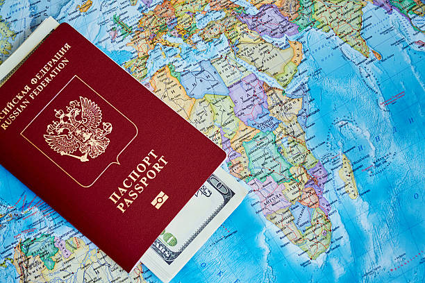 istock Passport and money on a topographic map 503116448