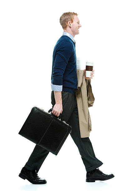 istock Smiling businessman walking and looking away 503117268