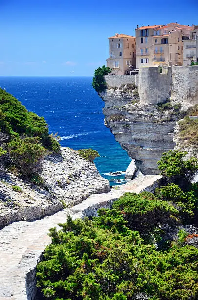 Houses of Bonifacio atop steep cliffs above the Mediterranean sea, Corsica, France