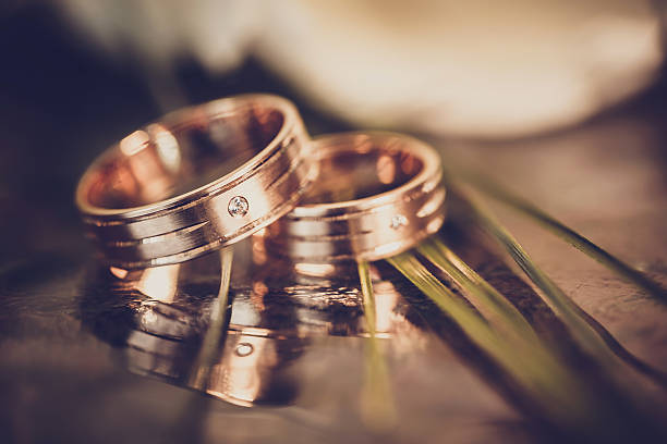 istock wedding concept - wedding rings and white tulips 503119210