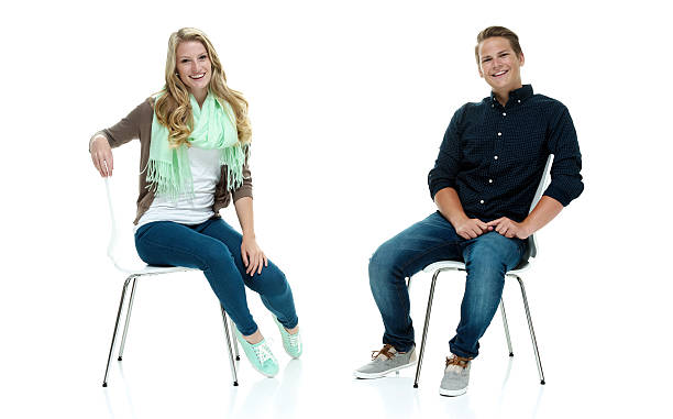 istock Smiling people sitting on chair & looking at camera 503119515