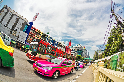Bangkok, Thailand - April 30, 2015: Taxis in Bangkok are looking for passengers. There are 150,000 taxis in Bangkok. All are metered with the starting fee of 35 Baht for the first 3 kilometers.
