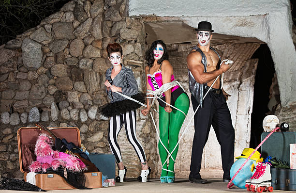 istock Clowns Tying Up Woman 503130684