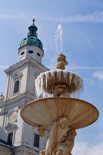 Fountain in Lubljana and castle tower