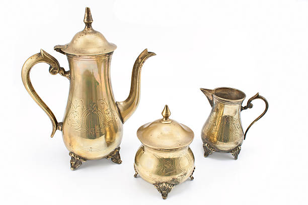 istock Set of antique silver teapots on white 503131463