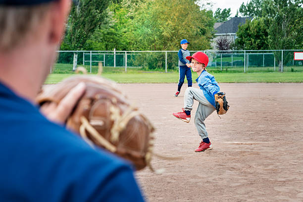 istock Dad playing baseball with his two sons in summer. 503131729