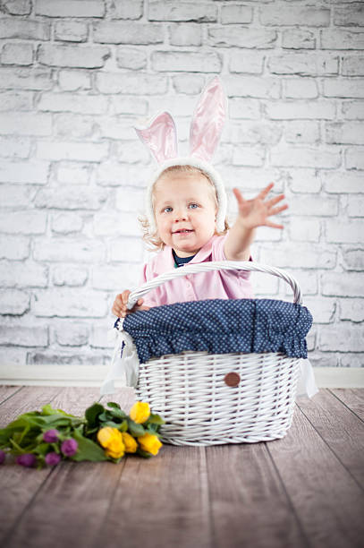 istock Cute baby bunny and tulips 503132789