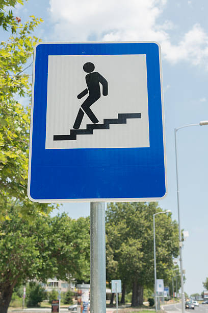 istock Road sign of a pedestrian underpass against blue sky. selective 503133420