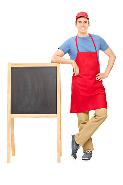 istock Young vendor standing by a blackboard 503133817