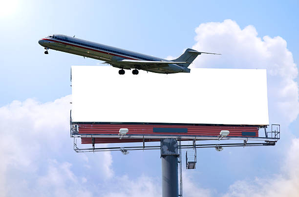 istock Travel concept blank roadside billboard with plane and sunshine 503134914