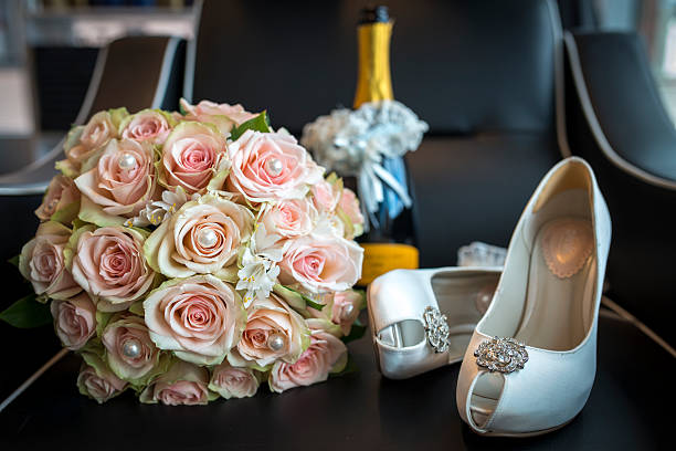 istock roses bouquet and white shoes for wedding 503134919