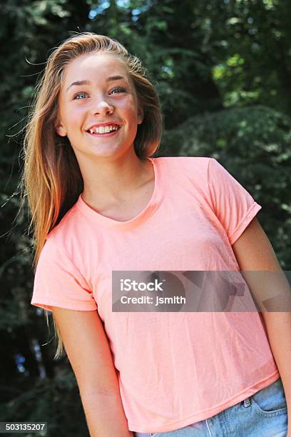 Teen Girl Smiles With Pink Shirt Stock Photo - Download Image Now - Smiling, Teenager, Casual Clothing